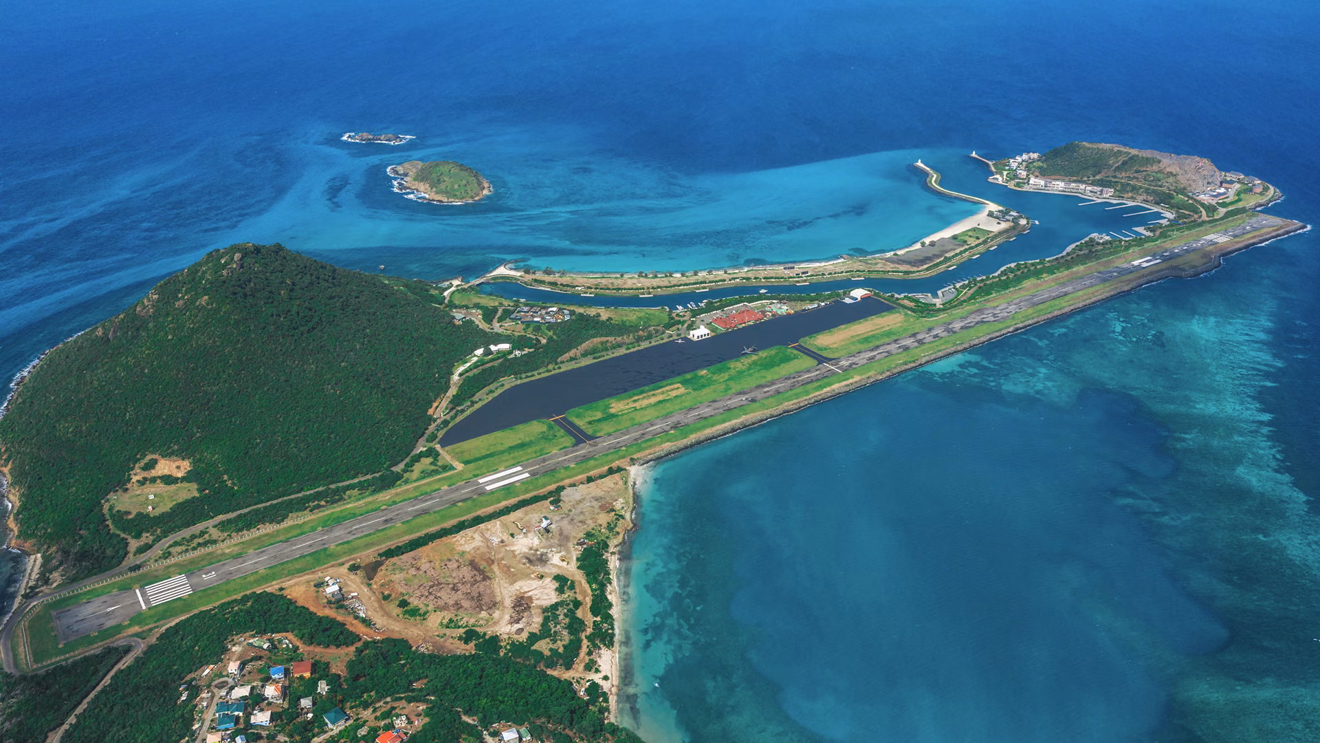 Aerial view of Canouan and its reef-fringed coastline